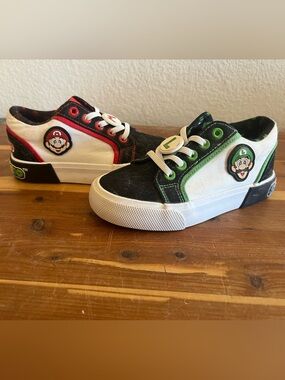 Kids Black, White & Green Character-Accent Slip-On Sneakers